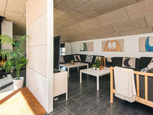 two views of a restaurant with tables and chairs at Luxury Retreat in Vorupor - By Traum Ferienwohnungen in Snedsted