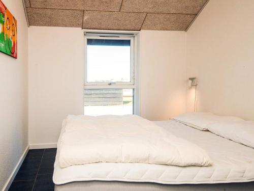 a bedroom with two beds and a window at Luxury Retreat in Vorupor - By Traum Ferienwohnungen in Snedsted