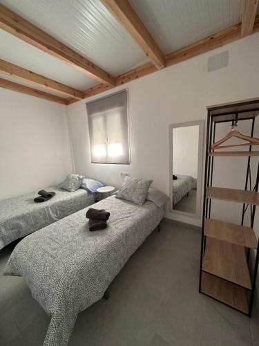 Postel nebo postele na pokoji v ubytování Casa Miguel Angel