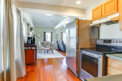 a kitchen with stainless steel appliances and a dining room at 1 Block to Dtwn Seneca Falls Apartment with Yard! in Seneca Falls