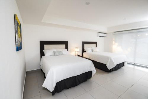 Voodi või voodid majutusasutuse Hotel Nicte toas