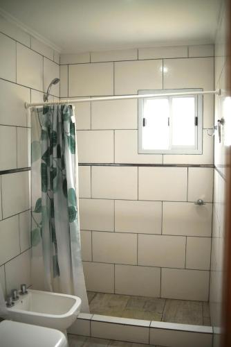a bathroom with a shower and a sink at Casa de campo Ranchos in Ranchos