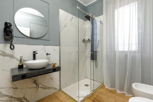 a bathroom with a sink and a mirror at Navona Sky Palace in Rome