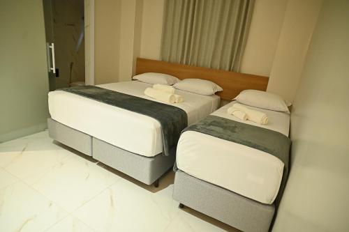 Postel nebo postele na pokoji v ubytování Viso Hotel