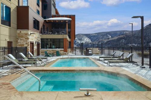 a swimming pool on the side of a building at SpringHill Suites by Marriott Avon Vail Valley in Avon