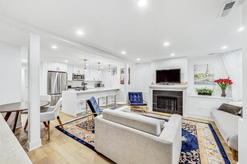 a living room with a couch and a table at Luxurious Lincoln Park Home with Gourmet Kitchen in Chicago
