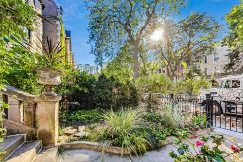 a garden with plants and a fence at Luxurious Lincoln Park Home with Gourmet Kitchen in Chicago