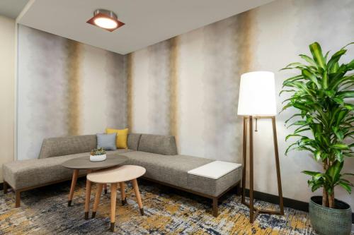 a living room with a couch and a table at TownePlace Suites by Marriott San Diego Carlsbad / Vista in Vista