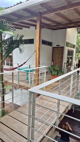 a man laying on the deck of a house at Eco del Mar in La Libertad