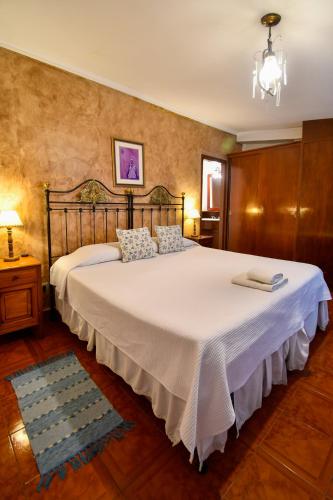 Ένα ή περισσότερα κρεβάτια σε δωμάτιο στο Hostal El Cerrito