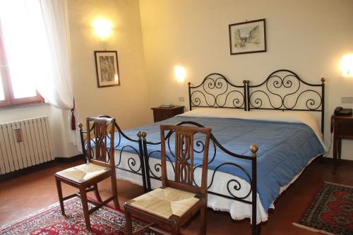 Postel nebo postele na pokoji v ubytování B&B L'Agnolo Di Caroti Cinzia