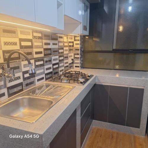 Dapur atau dapur kecil di Departamento Calido y Confortable