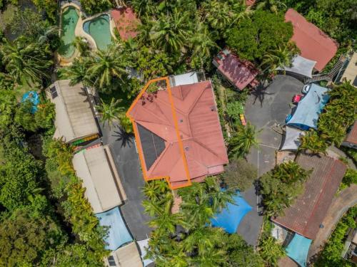 an overhead view of a house and a pool at Jacaranda Villa Korora Beach NSW in Kororo Basin