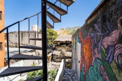 a mural on the side of a wall with stairs at Best Location in Sayulita + Walk to Everything in Sayulita