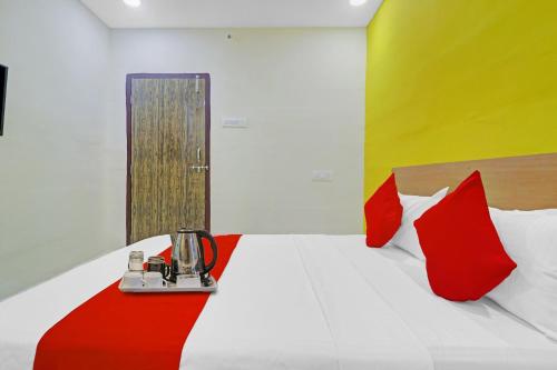 Postel nebo postele na pokoji v ubytování Hotel O Elite Stay