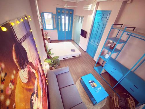 an overhead view of a living room with blue doors at BLUE with BALCONY 02 in Hanoi
