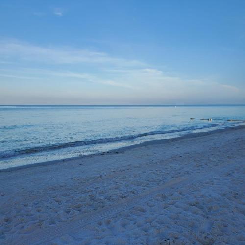 an empty beach with a view of the ocean at Studio Near Beach in Largo