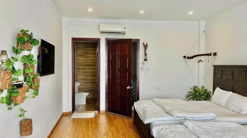 Postel nebo postele na pokoji v ubytování Nhà Của Táo HomeStay Quy Nhơn