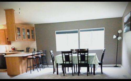a dining room with a table and chairs in a kitchen at Sequoia Eagle Nest in Three Rivers