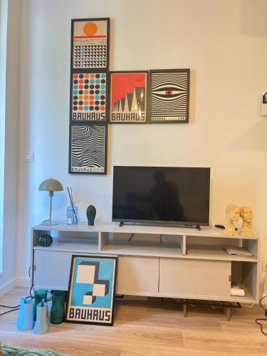 a living room with a flat screen tv on a wall at visit Brussels city in Brussels