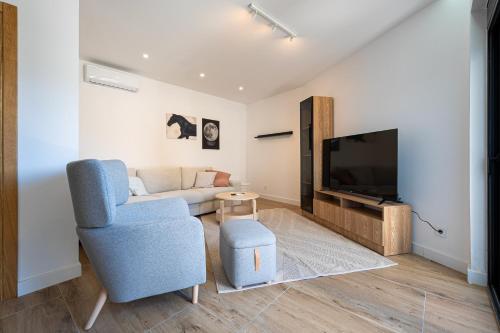 Et tv og/eller underholdning på Barber Apartment