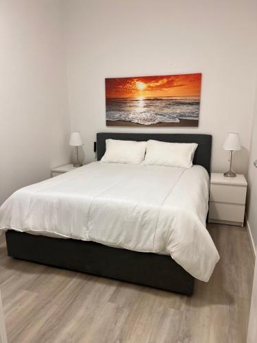 Ένα ή περισσότερα κρεβάτια σε δωμάτιο στο Sunny Sands Apartments