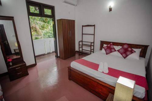 a bedroom with a bed and a ladder in it at 15 Degalla in Dodanduwa