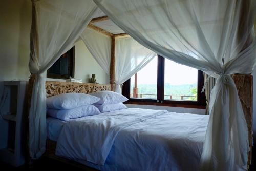 Postel nebo postele na pokoji v ubytování Hideaway House Bali