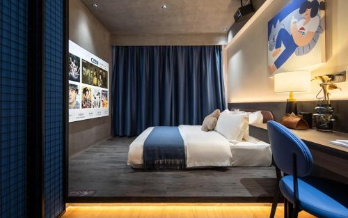 Ένα ή περισσότερα κρεβάτια σε δωμάτιο στο Tami Hotel Beijing Road Memorial Tower Subway Station Branch