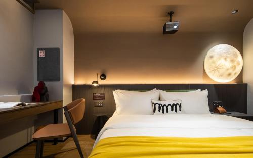 Ένα ή περισσότερα κρεβάτια σε δωμάτιο στο Tami Hotel Beijing Road Memorial Tower Subway Station Branch