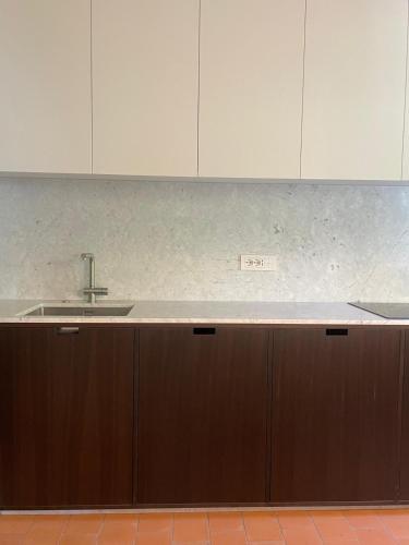a kitchen with a sink and a counter top at Lunavi in Forte dei Marmi