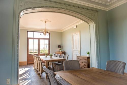 a dining room with a table and chairs at Gite la Blanche in Ogy