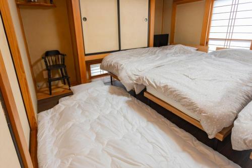 Una cama o camas en una habitación de 有康庵