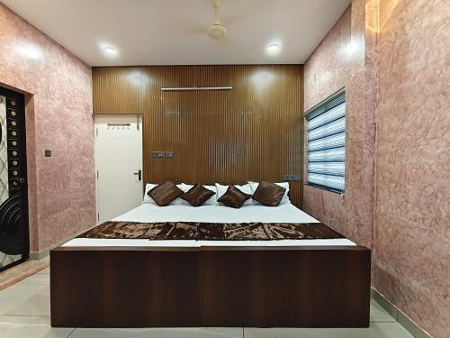 a bedroom with a large bed in a room at Casa De Nazareth Homestay in Cochin