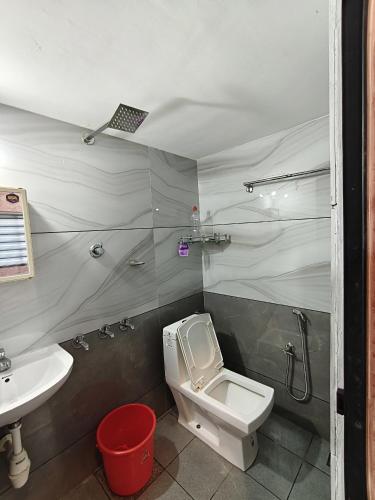 a bathroom with a toilet and a sink at Casa De Nazareth Homestay in Cochin