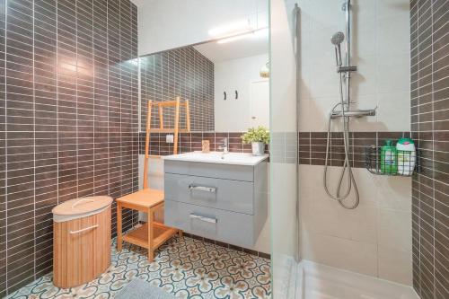 a bathroom with a sink and a shower at HideAway by MOJE Holiday in Porches