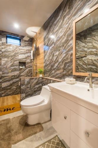 a bathroom with a toilet and a sink at Pin thong pool villa in Ao Nang 