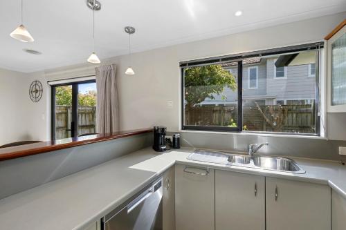 a kitchen with a sink and a window at Urban and Stunning 3 bed Home in Hutt Central in Lower Hutt