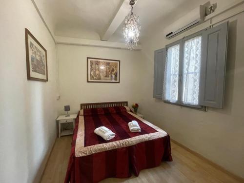 Ένα ή περισσότερα κρεβάτια σε δωμάτιο στο Ghibellina Kato