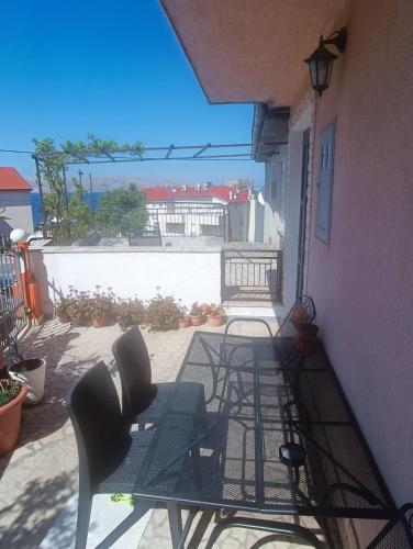 a patio with chairs and a table on a balcony at Guesthouse Martina in Senj