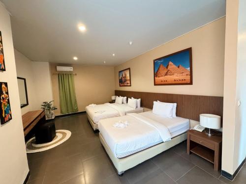 Hotel Ompu Hertiにあるベッド