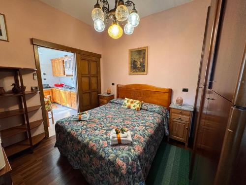 a bedroom with a bed with candles on it at Cozy HOUSE in San Salvatore