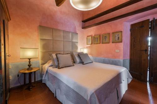 a bedroom with a large bed in a room at Villa Riflessi di Fiesole - Piscina - Vista Firenze in Fiesole