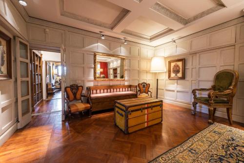 a large living room with a couch and chairs at Villa Riflessi di Fiesole - Piscina - Vista Firenze in Fiesole