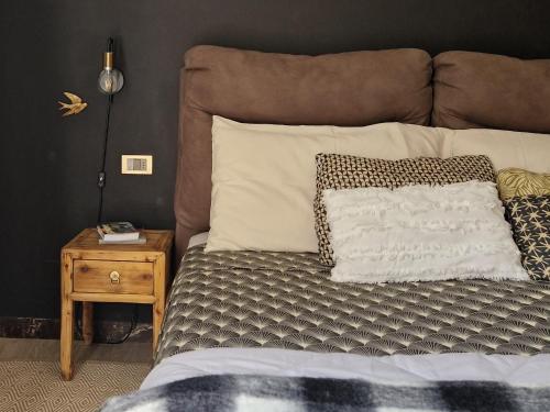 a bedroom with a bed with a pillow and a night stand at Acquadolce in Salò