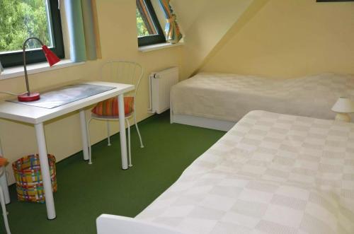 Postel nebo postele na pokoji v ubytování Christianshus Ferienhaus Vareler Hafen