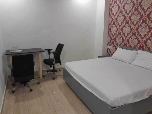 Postel nebo postele na pokoji v ubytování Hotel O Shubkamna