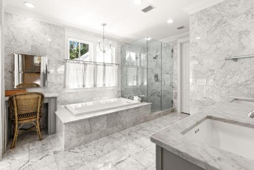 a large bathroom with a tub and a window at WaterColor Escape in Santa Rosa Beach