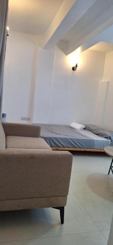 Ένα ή περισσότερα κρεβάτια σε δωμάτιο στο Citrus Studio a Cozy Nest