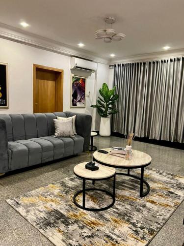 a living room with a couch and a table at Ezra court by cabana reality in Lagos